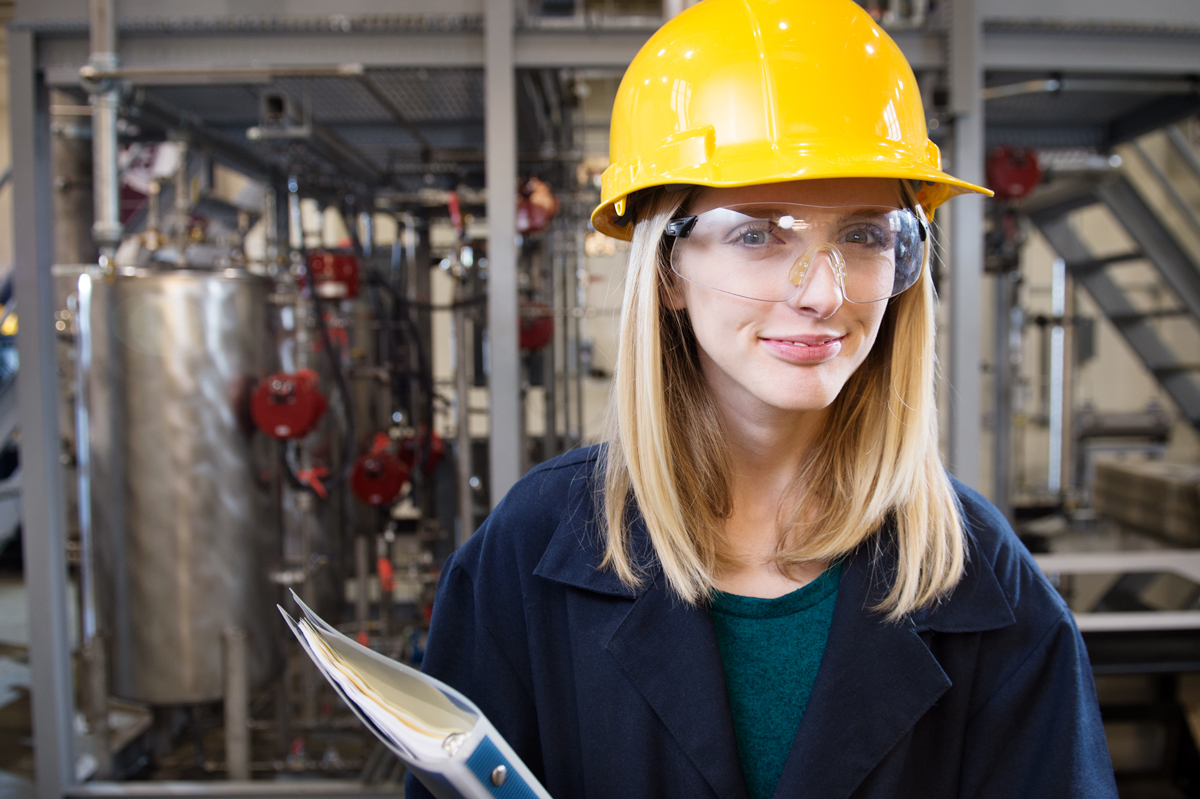 Brooke Barnett, pictured wearing a hard hat near engineering equipment.