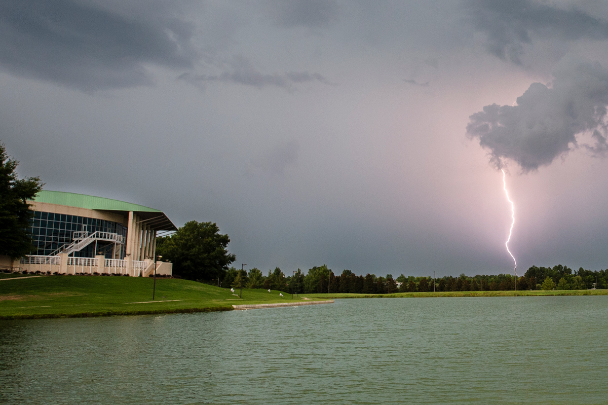 Lightning strikes in the distance of Chadwick Lake during a storm near Mississippi State&amp;#039;s campus.