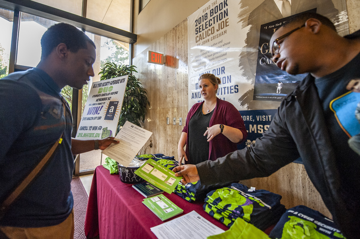 MSU Junior Biological Sciences major Daquon Benton receives information about cyber security and DUO sign-up in Allen Hall.