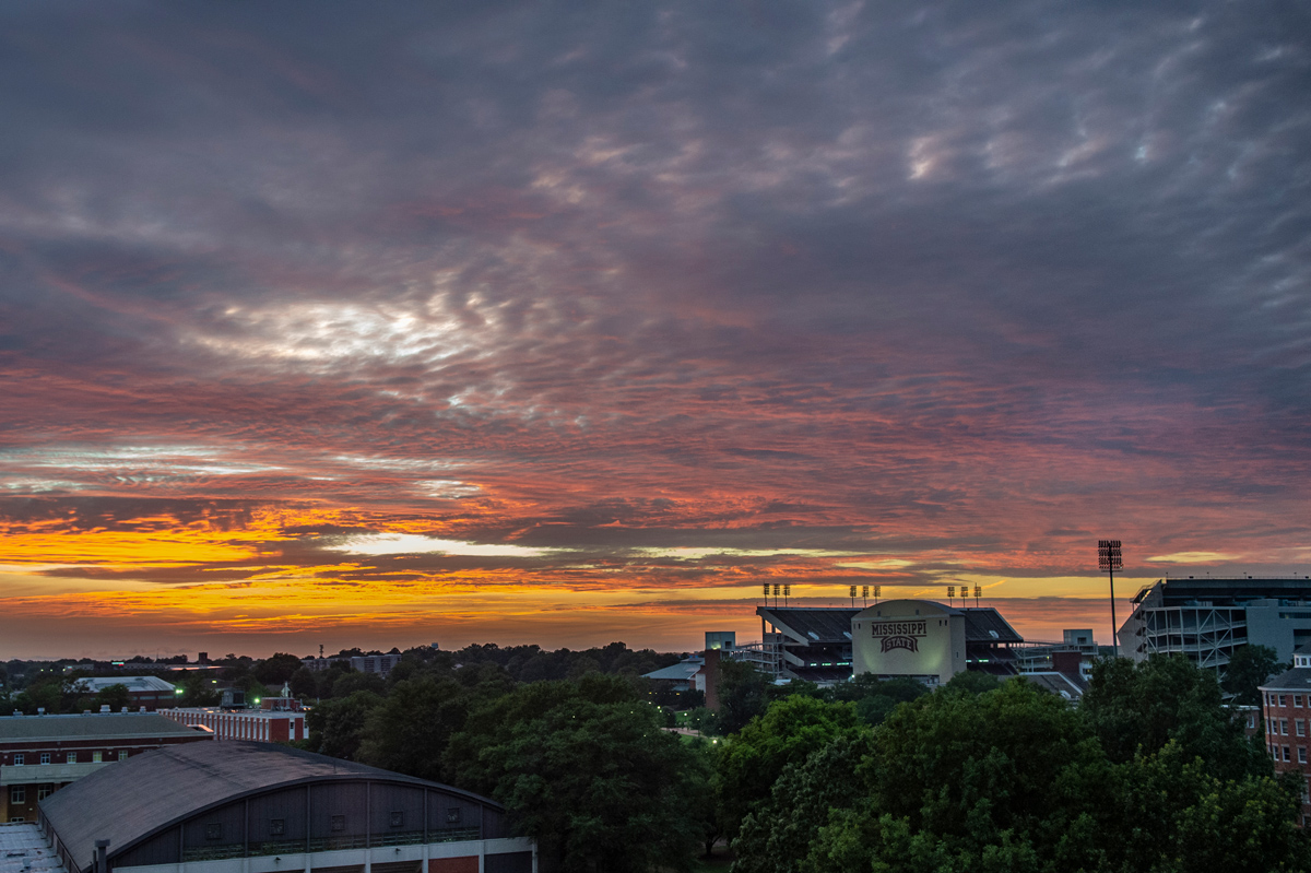 A sunset fills the sky with colors over Davis Wade Stadium.
