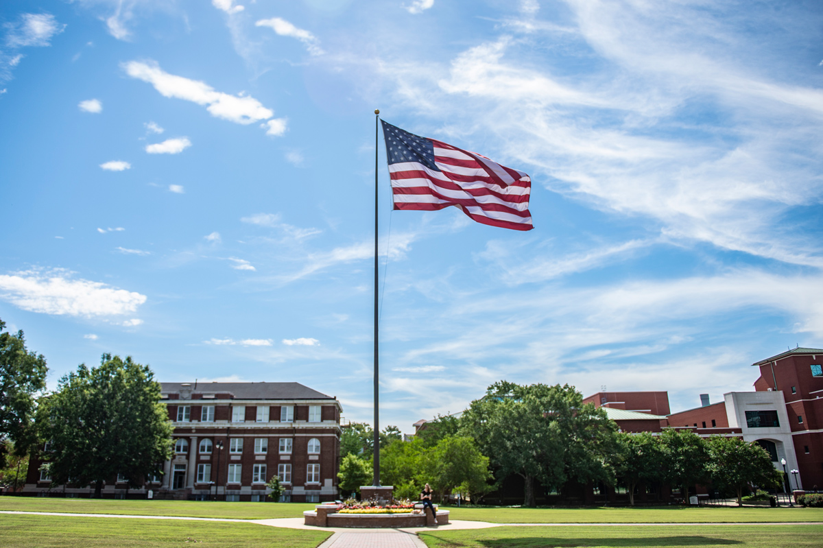 The American flag waves in the wind on the Drill Field.