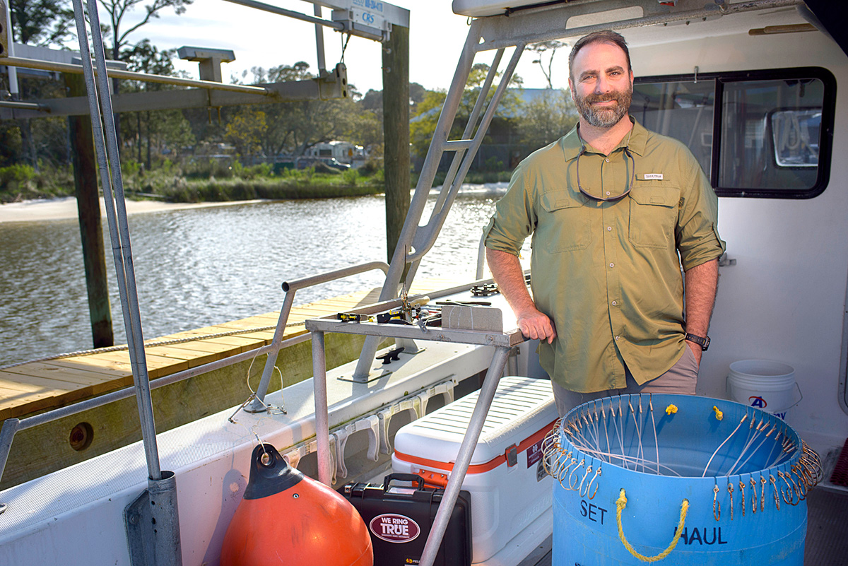 Marcus Drymon, pictured on a research boat.