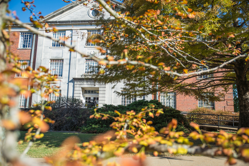 Magruder Hall framed by fall leaves