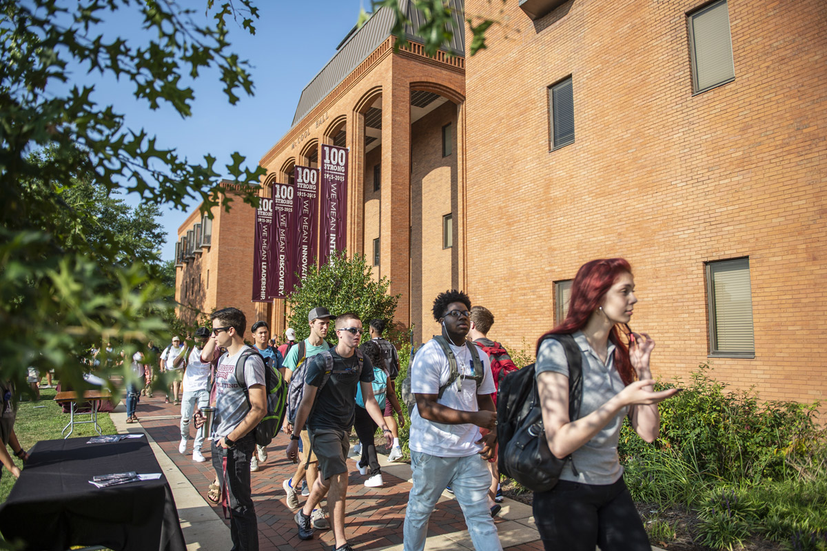 Students walk on campus during the first day of class.