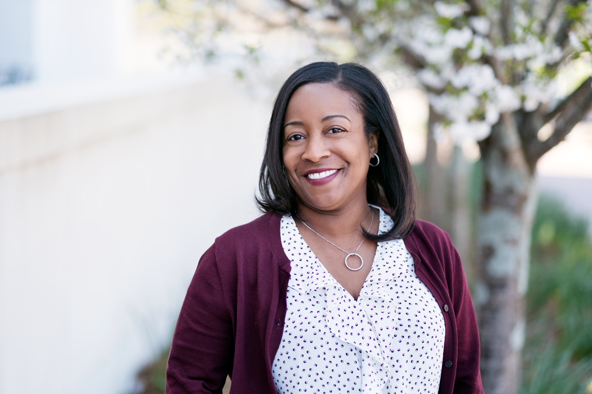 Melody Fisher, pictured in a scenic campus setting.