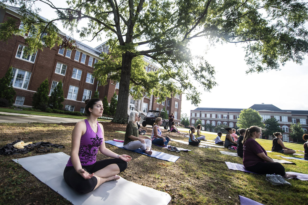 Dr. Emily Fortney does yoga on the Drill Field during one of MSU Recreation&amp;#039;s many different fitness events.