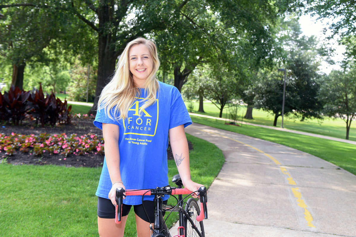 Heather Hardman, pictured on the MSU campus with her bike.