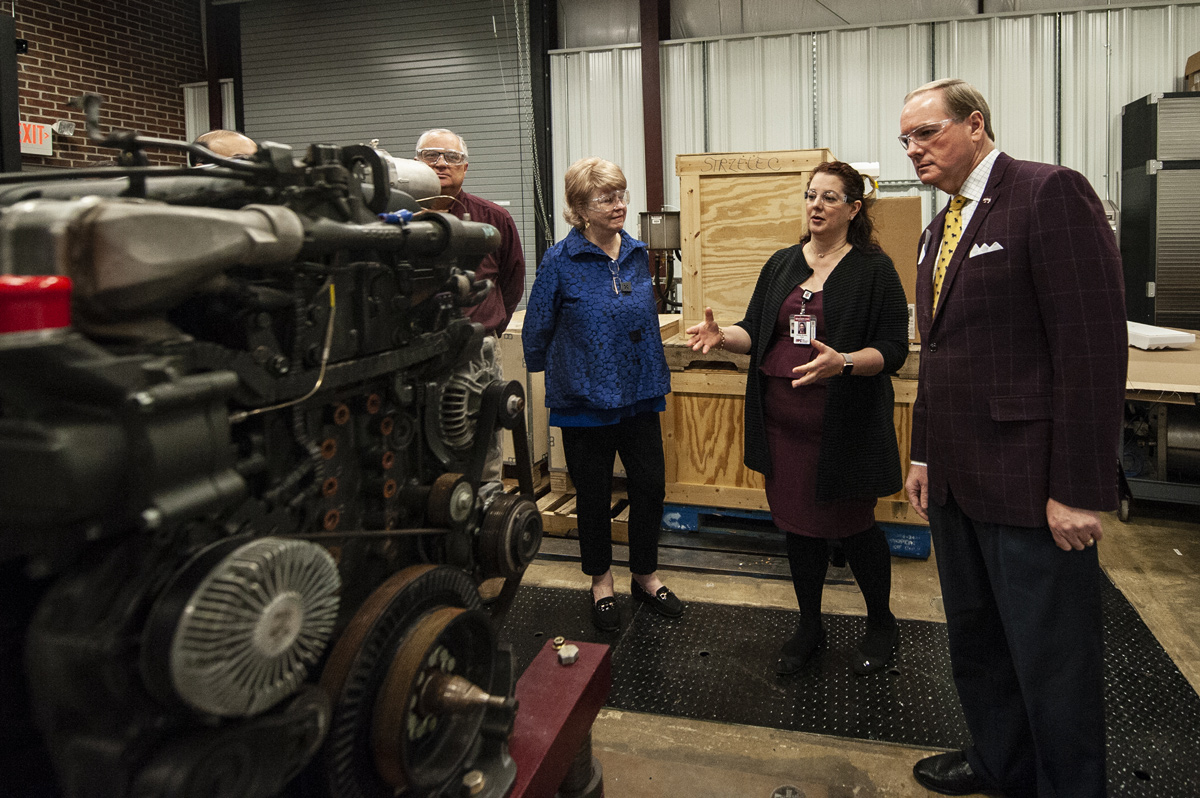 MSU President Dr. Keenum and Provost and Vice President Judy Bonner visits the CAVS engine lab.