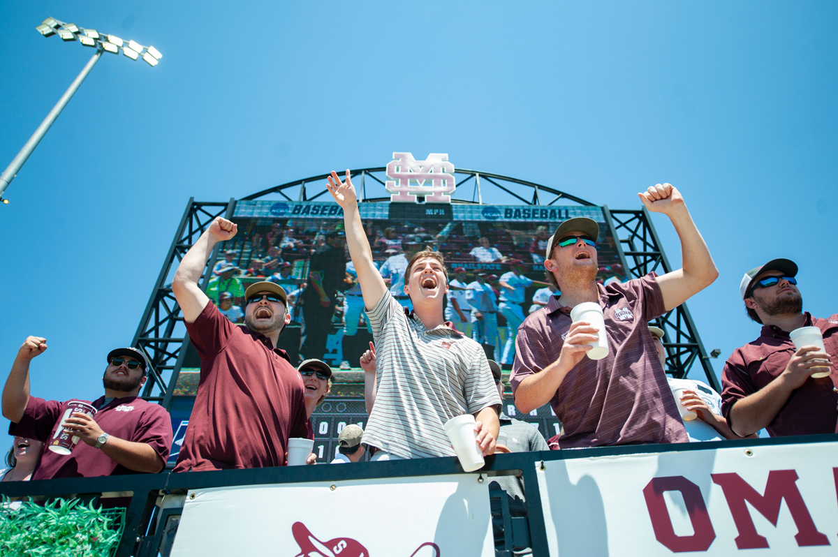 MSU fans cheer after the MSU baseball team scores a run during the first game of the NCAA Regional.