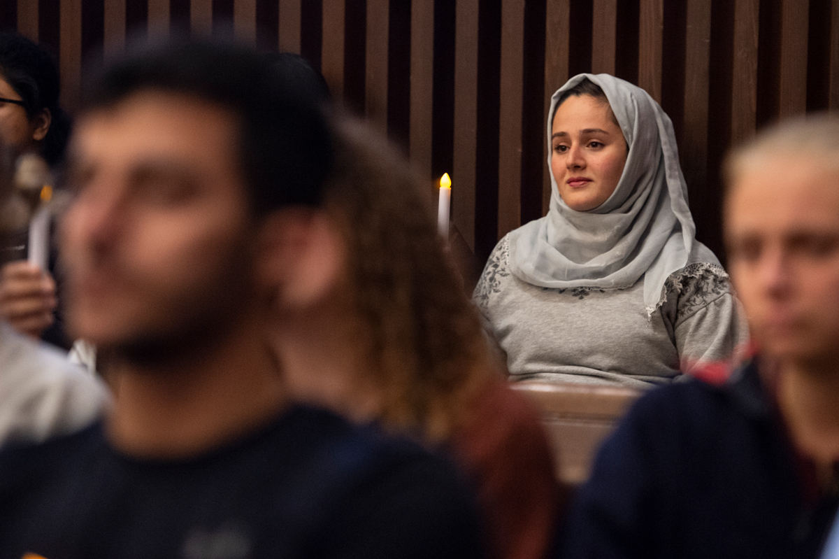 Dareen Altayyar holds a candle in remembrance of the victims of the New Zealand Mosque shootings.