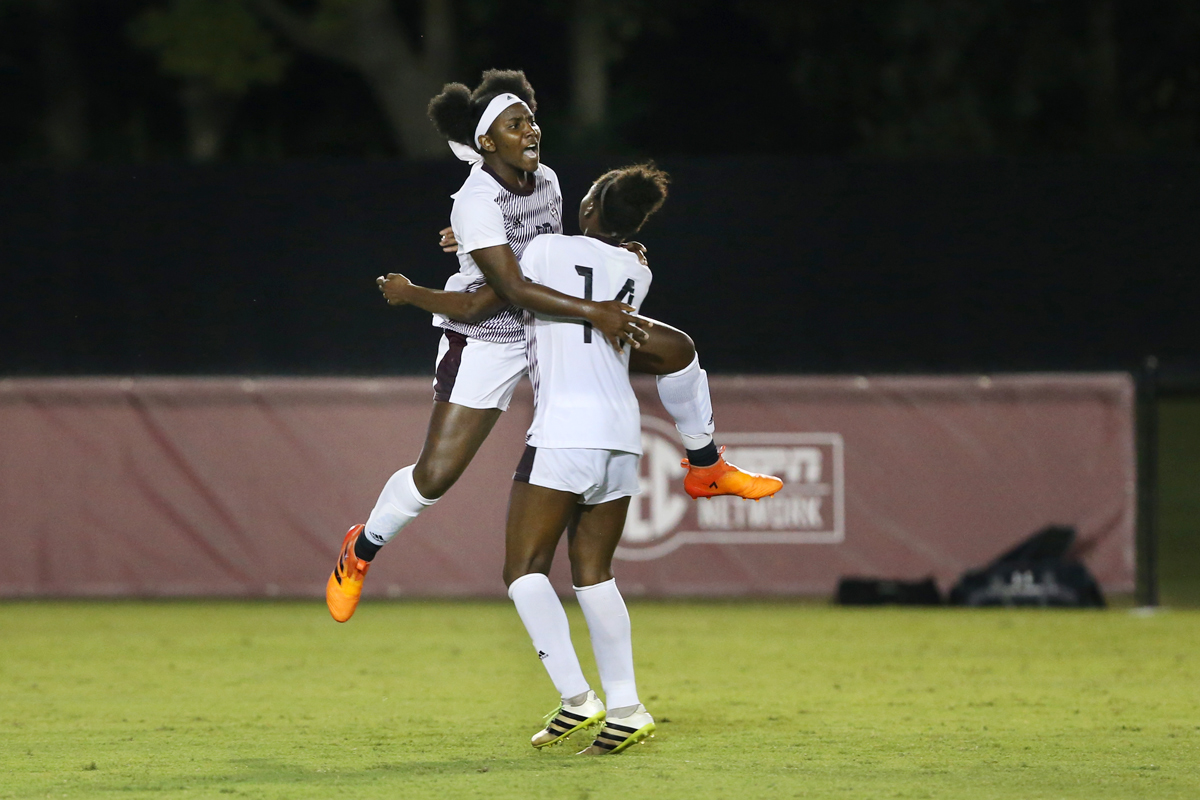 Freshman MSU Soccer player Zakirah McGillivary leaps in a celebratory hug with teammate Niah Johnson. 