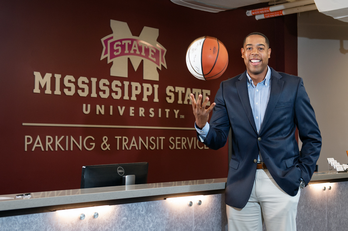 Terence Stringfellow, pictured tossing a basketball in front of the Parking Services front desk.