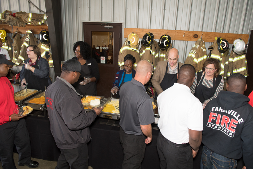 MSU and Starkville administrators, and MSU Dining Services serving Thanksgiving lunch to the Starkville Fire Department.