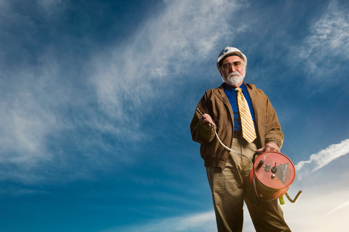 Dennis Truax, pictured outdoors with engineering equipment. 