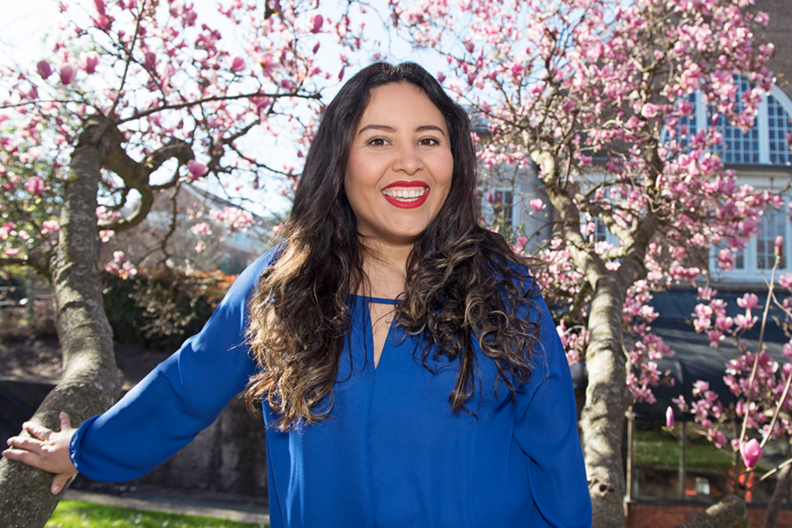 Vanessa Velasquez poses in front of a tree on the Mississippi State campus.