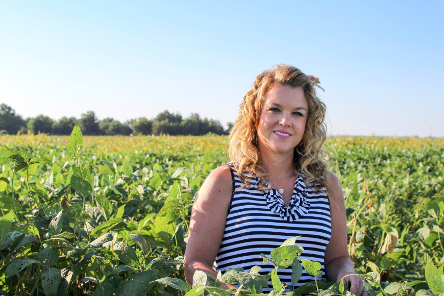 Tessie Wilkerson stands poses in a field.