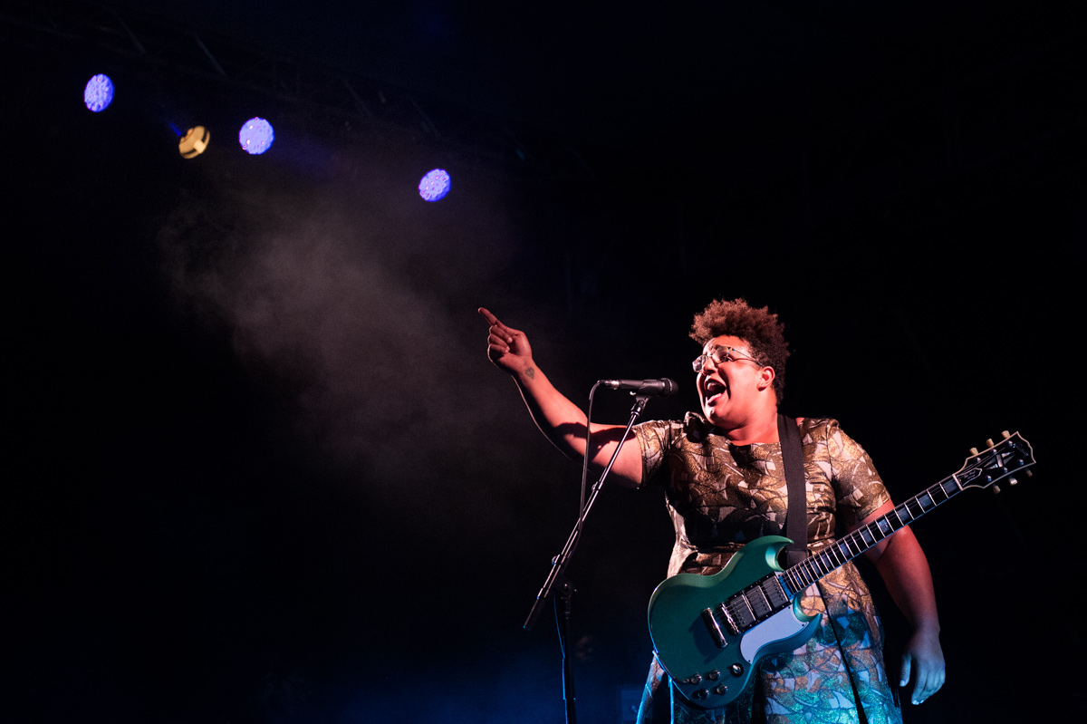 Alabama Shakes lead singer and guitarist, Brittany Howard, belts out a song at concert.