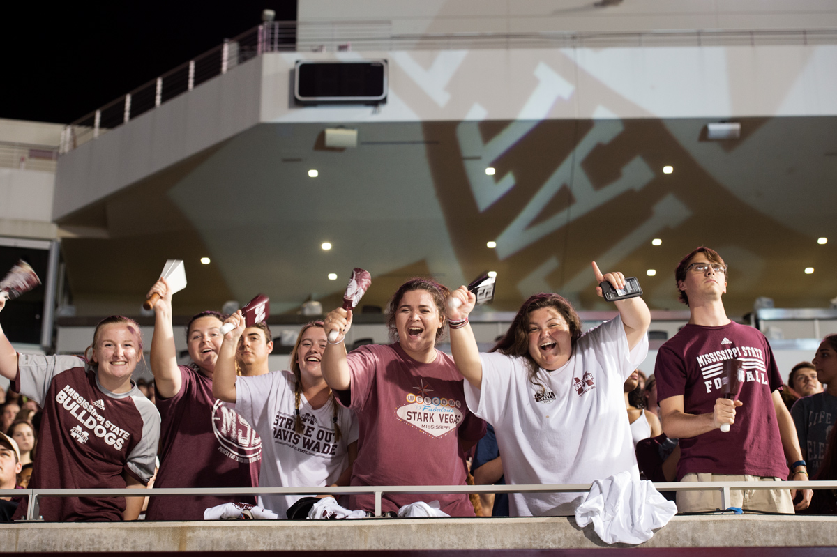 Students ring cowbells with enthusiasm during the Cowbell Yell pep rally.