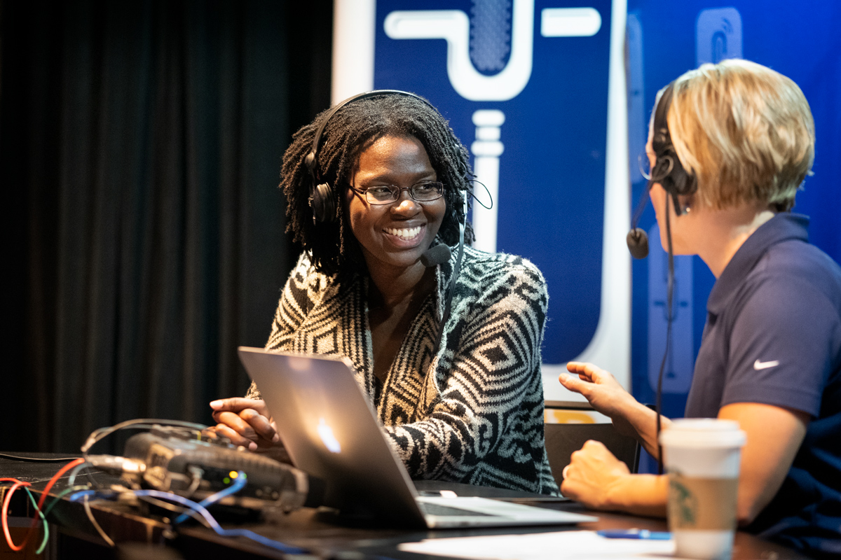 During live broadcast of SuperTalk radio, Professor Renita Horton talks to radio hostess Rebecca Turner. 