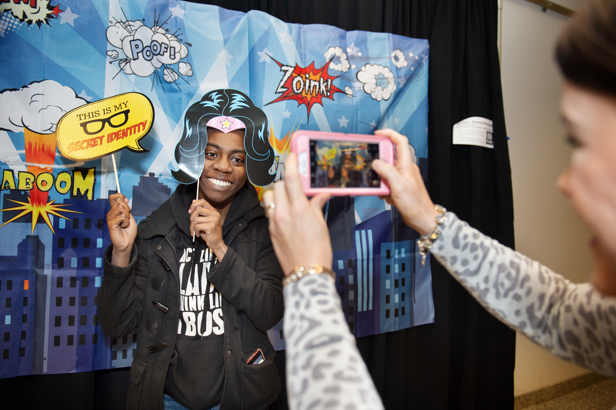 Political Science major Daetreeona Johnson has fun with PCSW&amp;#039;s Wonder Woman photo booth in the Student Union.
