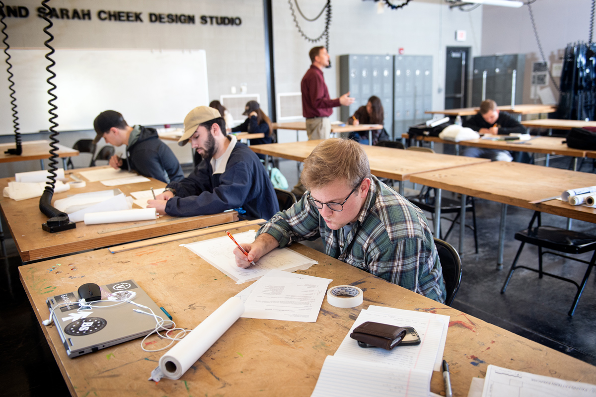 First year Landscape Architecture student Graham Hartness concentrates on drawing his design during Professor Walker&amp;#039;s class.