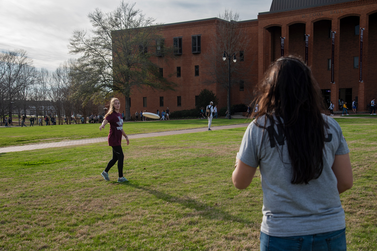  MSU Ultimate Frisbee club members Meredith Maynard, and Aygul &amp;quot;Goo&amp;quot; Brown throw a frisbee disc around while on the Drill field 