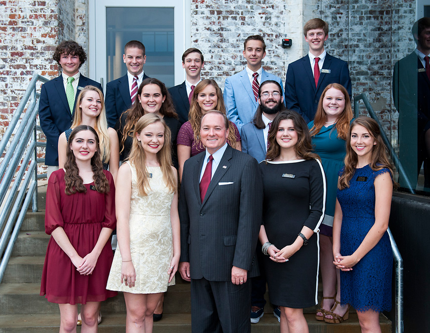President Mark E. Keenum welcomes the newest class of MSU Presidential Scholars. From left to right, they include (first row) Sarah Darrow, Elise Moore, Gentry Burkes, Kristen Lacy, (second) Flannery Voges-Haupt, Shelby Adair, Caroline Russell, Nick Ezzell, Stephanie Durr, (third) Ben Emmich, Spencer Callicot, David Sides, Charles Provine, and Ryan Stallcup. Karleigh Kimbrell is not pictured.  (Photo by Russ Houston)