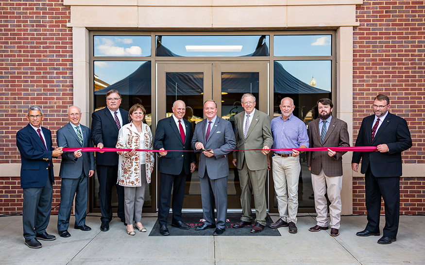 Administrators and partners involved in making the Animal and Dairy Sciences Building a reality were on hand to commemorate the opening of the building with a ribbon-cutting ceremony Monday [Sept. 30].