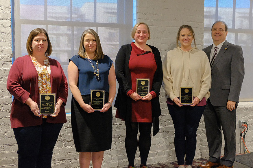 Pictured from left to right are Kimberly Kelly, associate professor of sociology; Shalyn Claggett, associate professor of English; Anna Osterholtz, assistant professor of anthropology; Whitnee Nettles, assistant clinical professor of chemistry, who accepted an award on behalf of Vicky Montiel-Palma, associate professor of chemistry; and MSU College of Arts and Sciences Dean Rick Travis. 