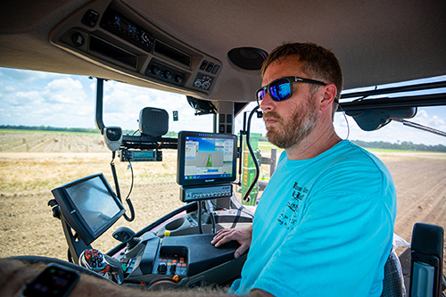 John Wallace, research associate II, operates the precision planter. 