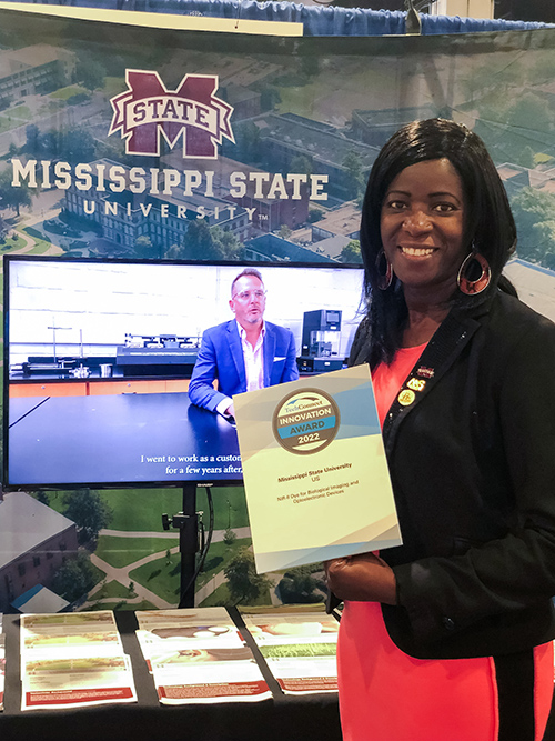 Colleen Scott, pictured holding her TechConnect Innovation Award