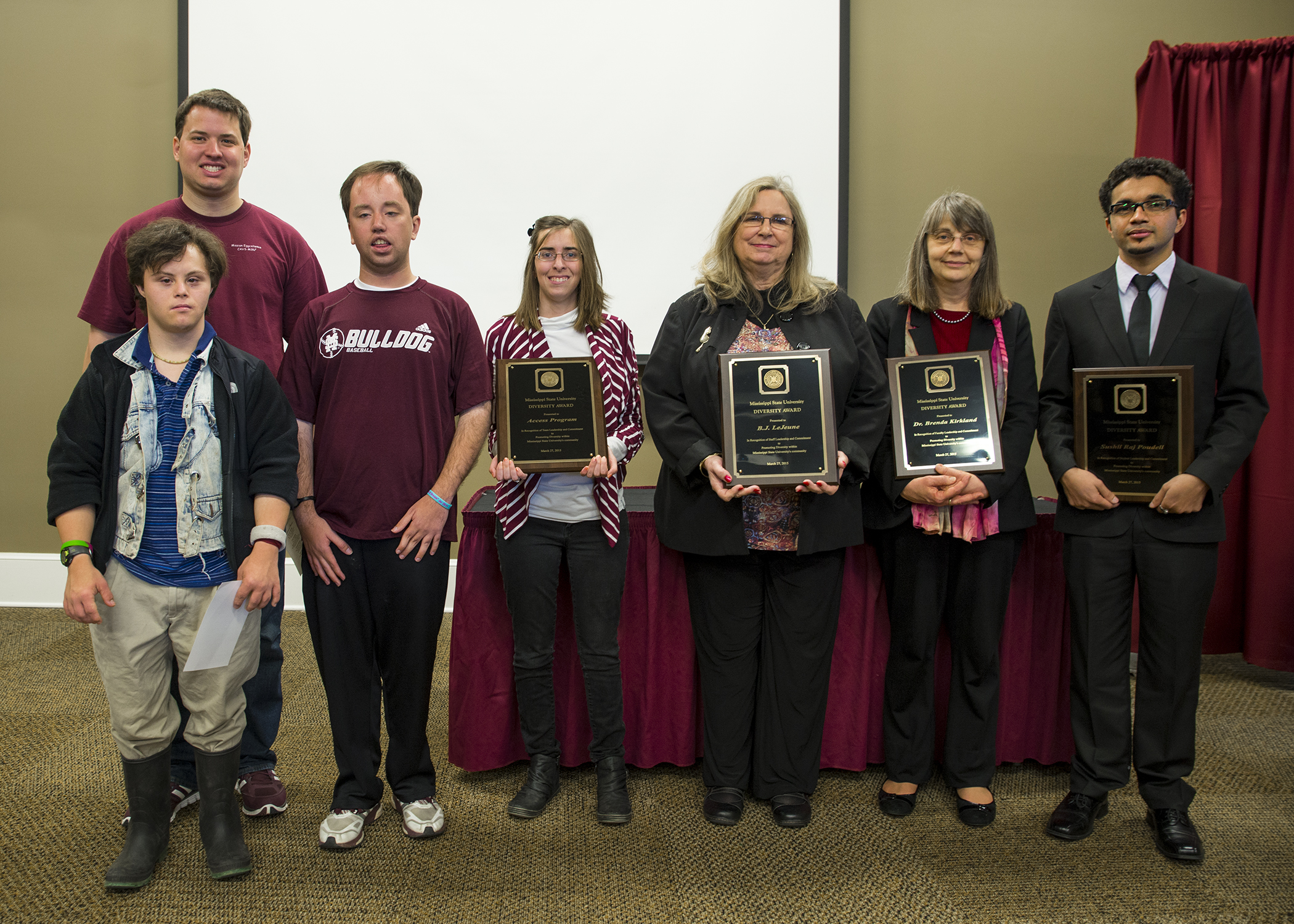 Accepting 2015 Diversity Awards from the MSU President's Commission on the Status of Minorities are, from left, Joe Silvera (front), Daniel Mooney, Wade Sims, and Amanda Byrd, for the campus' ACCESS program; staff member B.J. LeJeune; faculty member Brenda Kirkland; and doctoral student Sushil Raj Poudel. Accepting 2015 Diversity Awards from the MSU President's Commission on the Status of Minorities are, from left, Joe Silvera (front), Daniel Mooney, Wade Sims, and Amanda Byrd, for the campus' ACCESS program; staff member B.J. LeJeune; faculty member Brenda Kirkland; and doctoral student Sushil Raj Poudel.