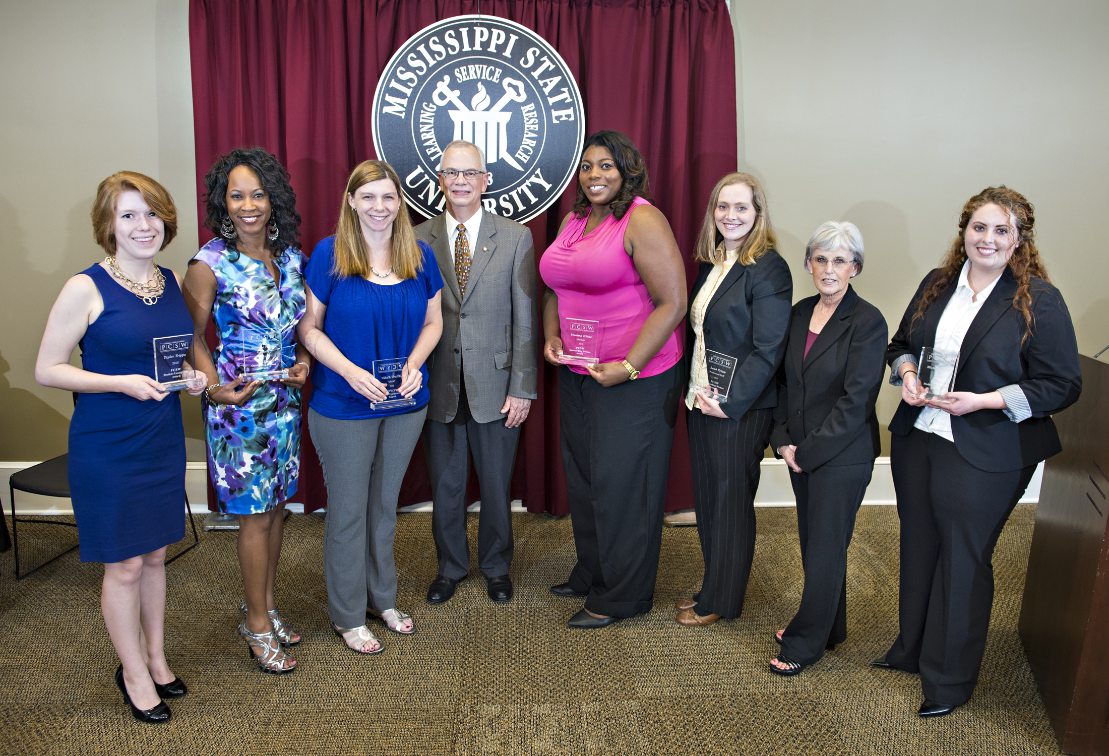 The President's Commission on the Status of Women recognized seven ladies with Outstanding Women Awards on Tuesday. From left are honorees Taylor Trippe, Tammie Tubbs and Nicole Rader; MSU Provost and Executive Vice President Jerry Gilbert; and honorees Vemitra White, Leah Pylate, Judy Hammett and Michelle Lewis.
