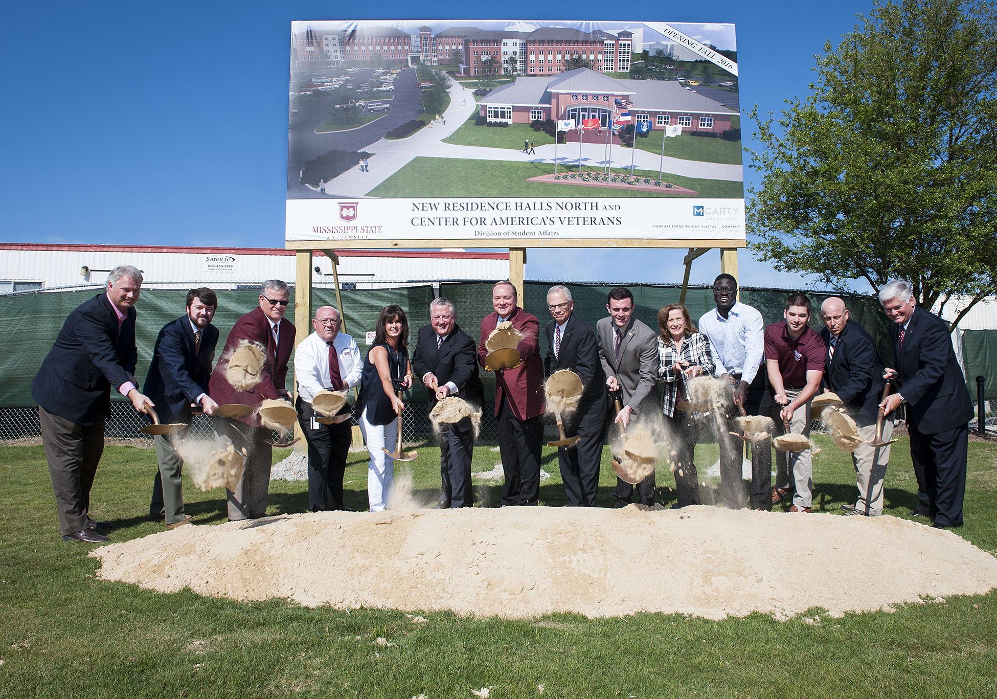 Celebrating the groundbreaking for MSU's new residence halls and veteran's facility May 8 were, from left, Benjamin Tarver of Yates Construction; Justin Harrington of The McCarty Company; Tim Muzzi, MSU interim director for planning, design and construction administration; Kenneth McRae, director of the G.V. "Sonny" Montgomery Center for America's Veterans; Terri and Tommy Nusz, MSU alumni and project supporters; MSU President Mark E. Keenum; Jerry Gilbert, provost and executive vice president; JoJo Dodd, Student Association president; Ann Bailey, interim assistant vice president for student affairs; Talla Cisse, Residence Hall Association president; Cadet Michael Lukens, Student Veteran Association president; Fred Mock, interim director for student housing; and Bill Broyles, interim vice president for student affairs. 