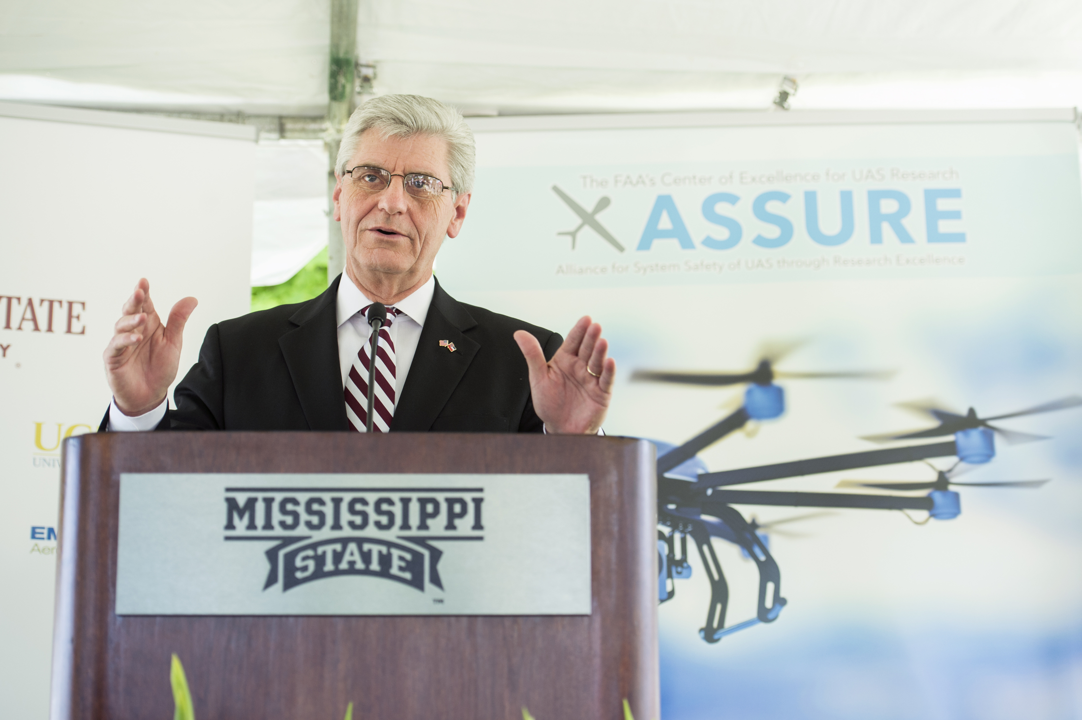 Gov. Phil Bryant speaks at Mississippi State University Friday [June 5] during a campus press conference about the Federal Aviation Administration designating the university as the National Center of Excellence for Unmanned Aircraft Systems. Bryant lauded MSU's leadership and the positive impact that ongoing research and development will have on the state's economy. Bryant said research at MSU has led the world in aerospace, automobile manufacturing and agribusiness.