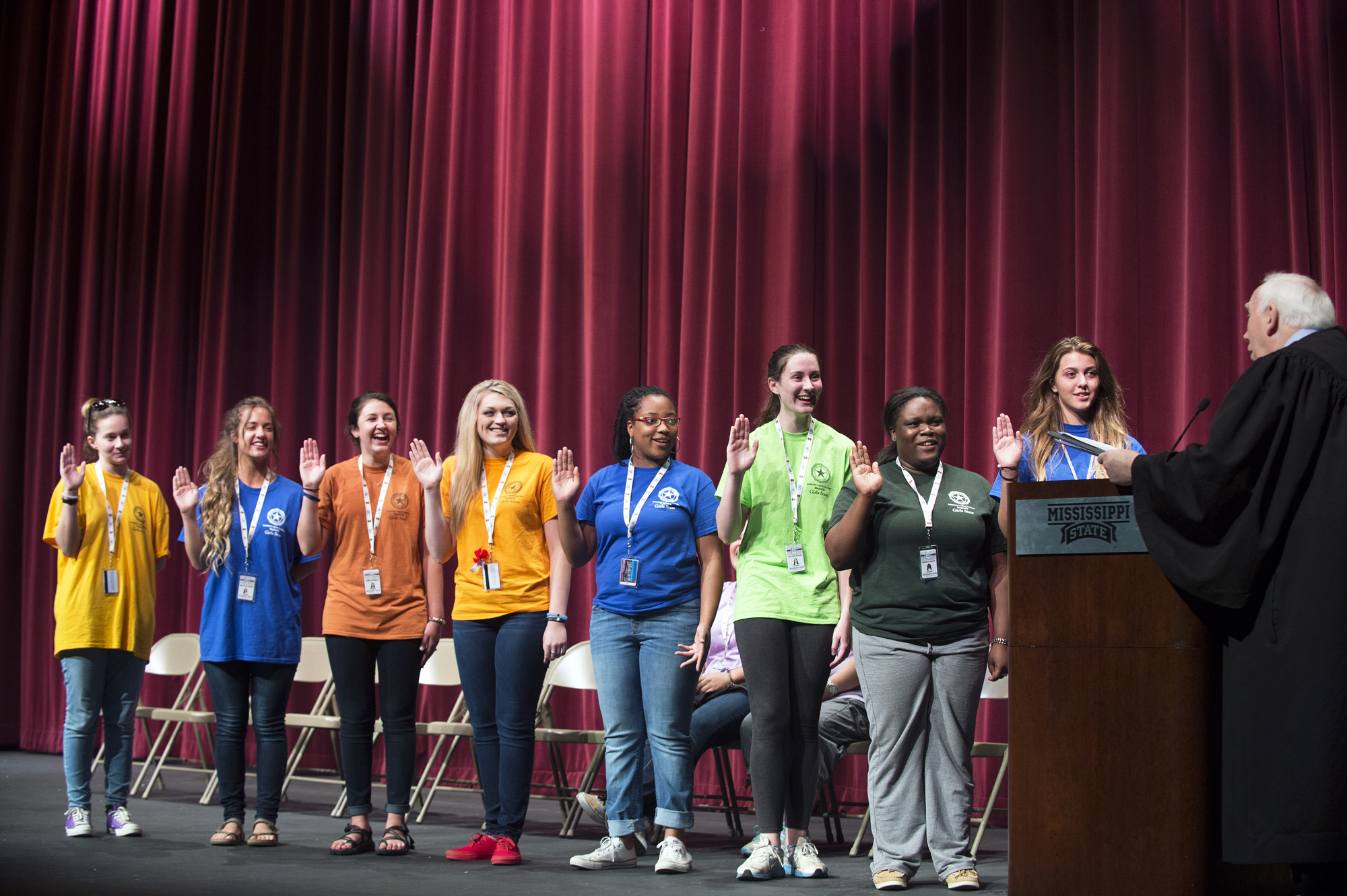 Mississippi Supreme Court Associate Justice James W. Kitchens swears in the newly elected officers during the Mississippi American Legion Auxiliary Girls State program this week at MSU. Taking the oath are Madeline Beasley, commissioner of agriculture; Britton Webb, commissioner of insurance; Anna Daniels, attorney general; Ashlyn Stringfellow, state auditor; Jasmine Whitker, state treasurer; Ceili Rassier, secretary of state; Georgia Griffin, lieutenant governor; and Caroline Bell, governor.