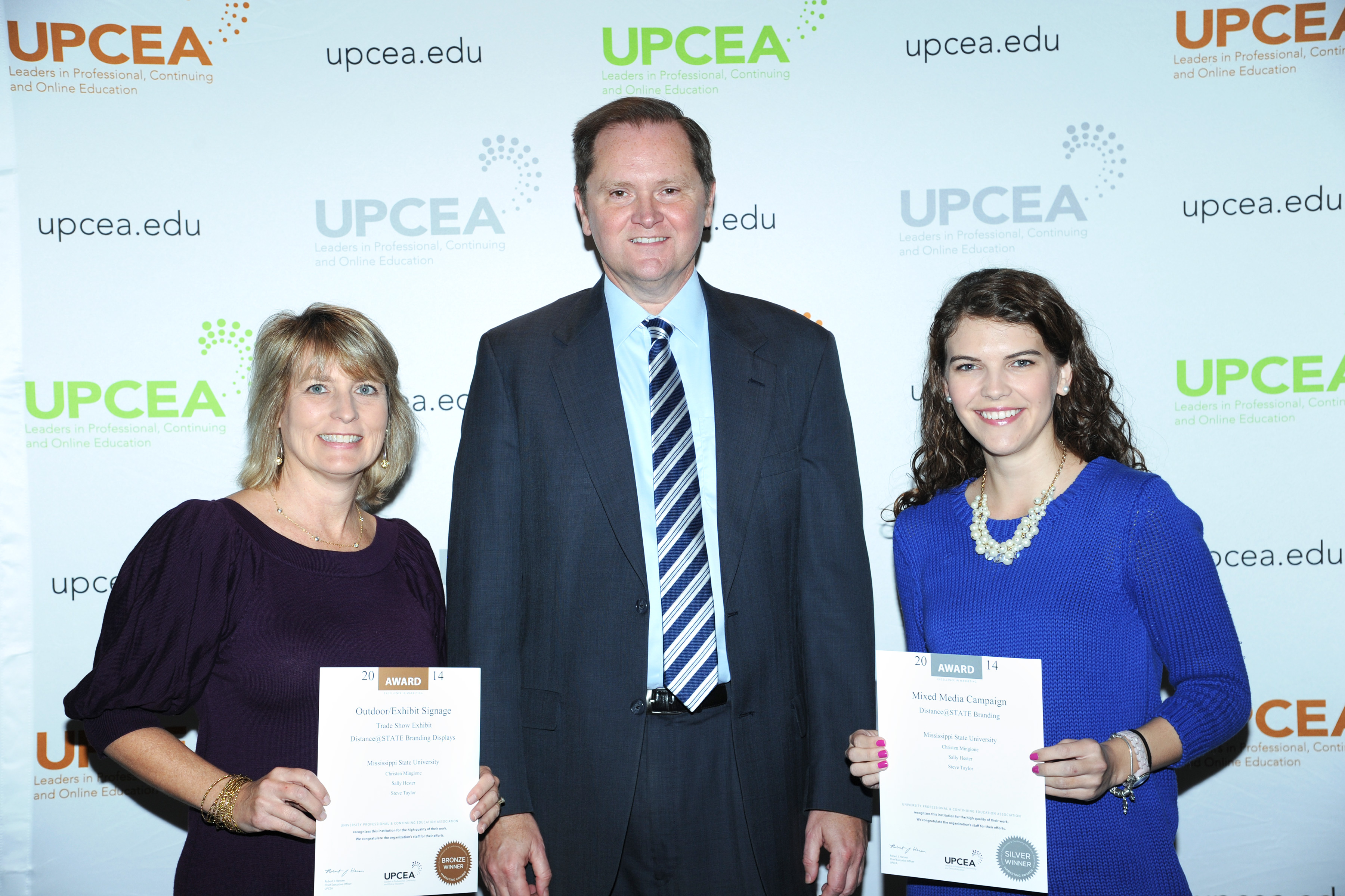 Pictured receiving the award for MSU's Center for Distance Education are, from left, Mindy Wolfe, CDE program coordinator; Bob Hansen, UPCEA CEO; and Tatum Turan, CDE communications specialist. 
