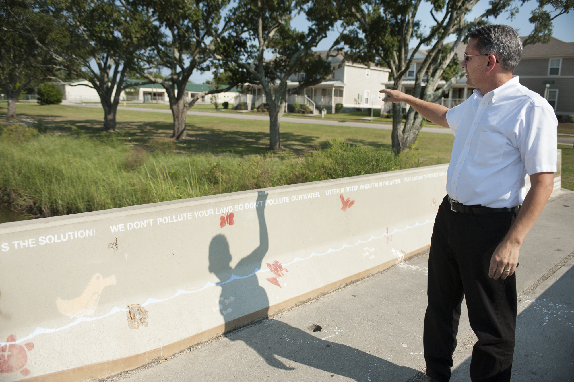 David Perkes, director for the Gulf Coast Community Design Studio, looks over the site of the Bayou Auguste restoration project in 2012 at East Biloxi. A division of Mississippi State University's College of Architecture, Art and Design, the design studio recently won a Gulf Guardian Award from the Environmental Protection Agency's Gulf of Mexico Program. The team secured grants and utilized volunteers to build a neighborhood wetland park at the site. 