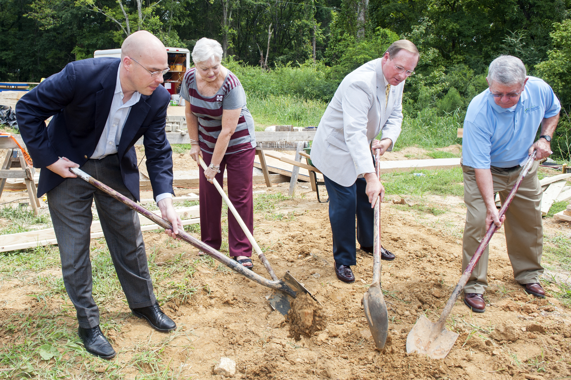 Mississippi State University and the Starkville Area Habitat for Humanity broke ground Monday [Aug. 10] at the site of the seventh annual Maroon Edition home, located at No. 5 Hope Lane in Starkville. (From left) Starkville Mayor Parker Wiseman; Starkville Habitat Board President Suzanne Dressel; MSU President Mark E. Keenum; and Starkville Habitat Past President Danny Setaro officially break ground for the home. Keenum also drove the ceremonial first nail. 