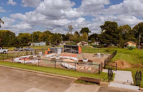 An overview photo of the learning garden at Galloway Elementary School in Jackson shows trellises and concrete benches among it structures.
