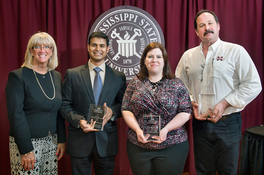 Honored this week with 2015-16 MSU Alumni Association faculty awards were (second from left to right) Veera Gnaneswar Gude, Kimberly C. Kelly and Brian S. Baldwin. Presenting the awards was Libba Andrews (at left), alumni association associate director. (Photo by Megan Bean)