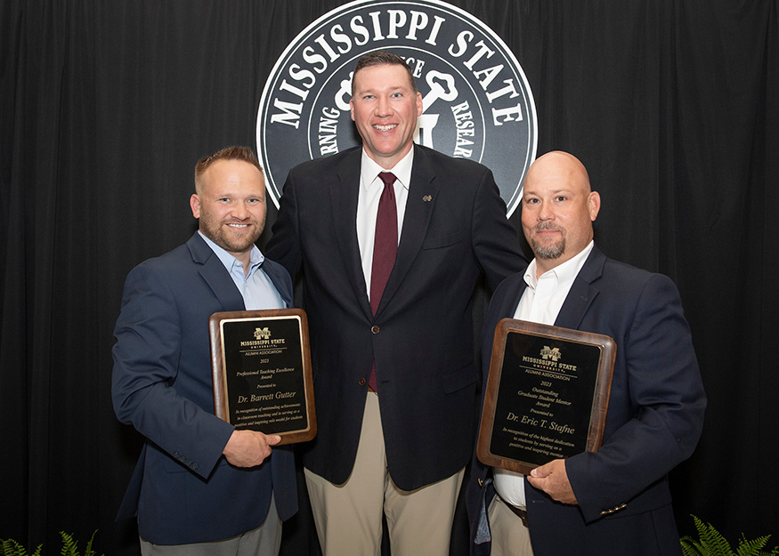 Alumni Association Executive Director Jeff Davis, middle, is pictured with Teaching Excellence Award recipient Barrett Gutter, left, and Darrin Dodds, right, accepting the Outstanding Graduate Student Mentor Award on behalf of Eric T. Stafne.