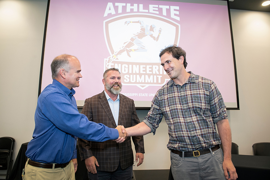 Eric Skaggs, Mark Ronay and Reuben Burch shake hands to celebrate a new partnership.