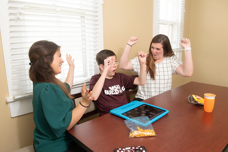 Students work with an individual at the MSU Autism and Developmental Disability Clinic. 