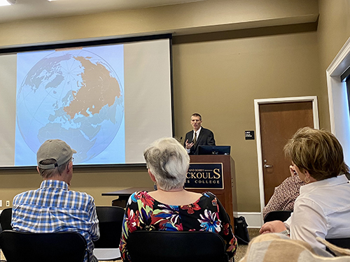 Stephen Brain presents during a lecture in Griffis Hall