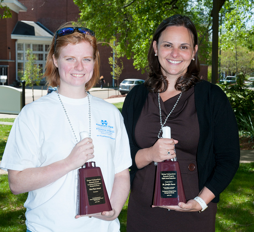 First-place recipient Kellie Mitchell of Chelsea, Alabama, with symposium keynote speaker Jennifer Sasser of the University of Mississippi Medical Center in Jackson.