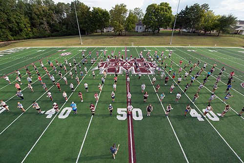 A portion of the Famous Maroon Band practices a choreographed marching routine 