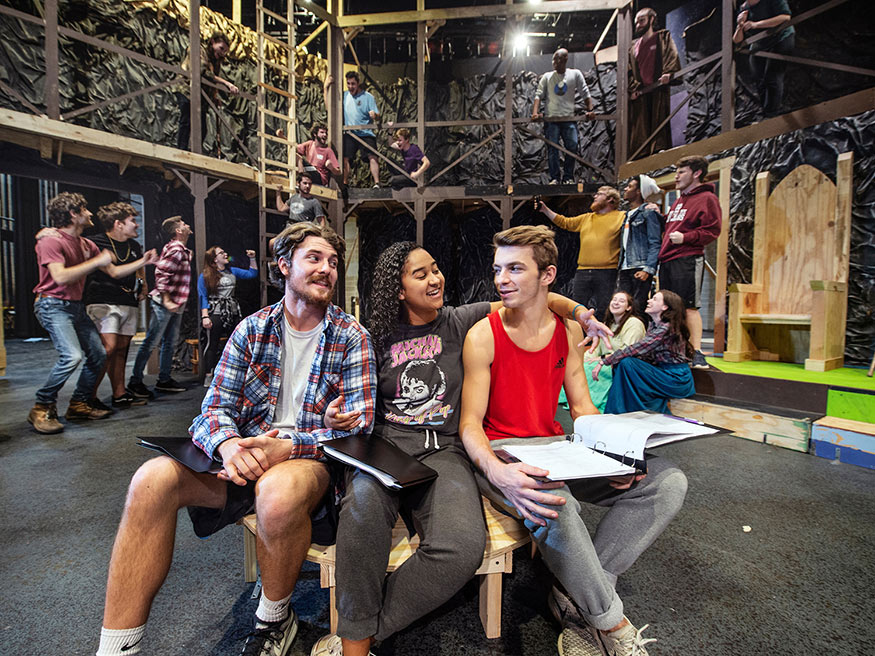Theatre MSU students (l-r), Nathan R. Cleveland of Dennis, Preslie A. Cowley of Cleveland, and Jonathan M. Tackett of Coldwater are pictured in the foreground at a “Beowulf” rehearsal on McComas Hall’s main stage. 
