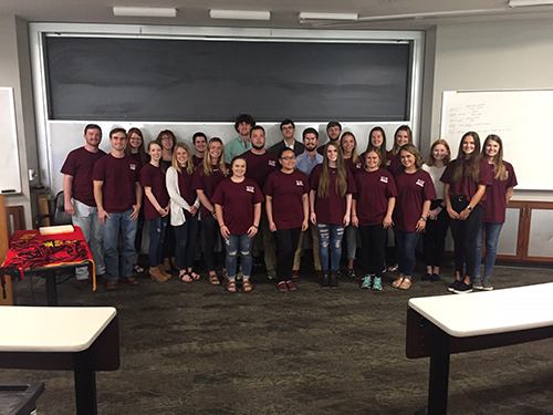 Members of Beta Alpha Psi pose for a group photo