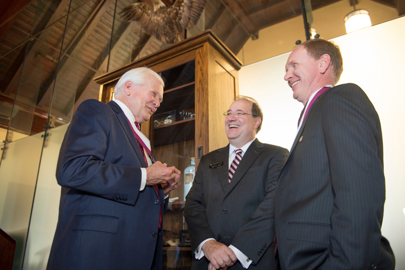 In recognition of his accomplishments and leadership, Mississippi State Biological Sciences Department Head Angus Dawe (right) was formally appointed Friday [Sept. 9] as the College of Arts and Sciences’ first endowed professor. The Cornwall, England, native has been named the Dr. Donald L. Hall Distinguished Professor, a position made possible with an endowment created by its namesake, (left) 1962 MSU pre-medicine graduate and Vicksburg native Donald L. Hall. Congratulating Dawe and Hall is Rick Travis, interim dean of the College of Arts and Sciences, MSU’s largest academic unit that is marking its 60th anniversary this fall. (Photo by Megan Bean)